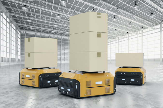 Roboter in einer Lagerhalle symbolisieren die Automatisierung in der Logistik.